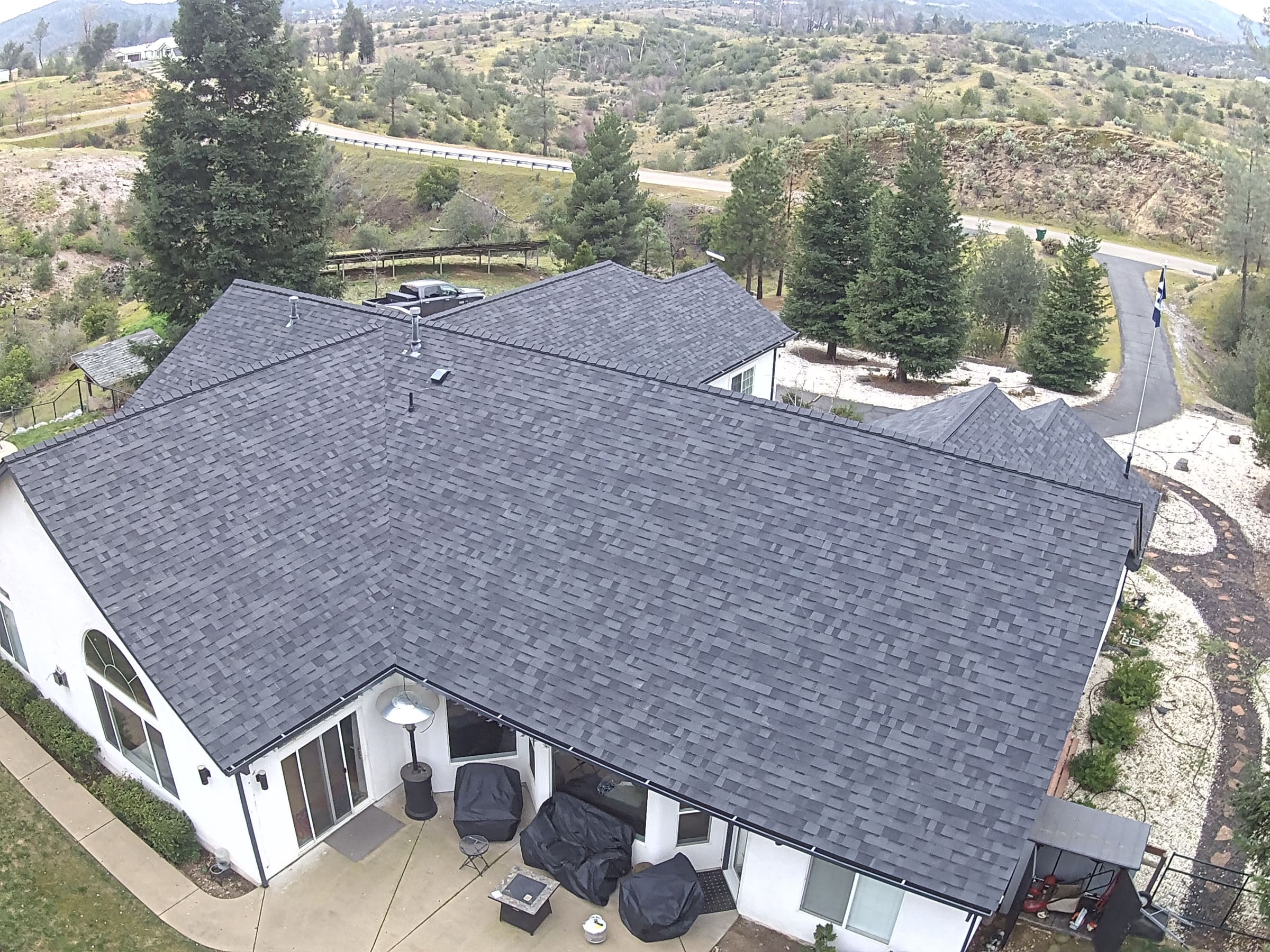 Aerial drone photo of a completed Loomis Roofing shingle roof replacement near Redding, CA
